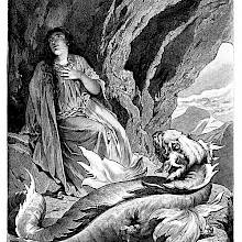 A woman sits in a cave high in the mountains with a dragon at her feet