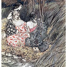 Three young women are sitting on a river bank, surrounded by rushes