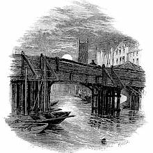 A wooden bridge is seen from the wharf with the moon and a tower in the background