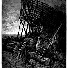 Men are working on the construction of a ship, its structure silhouetted against the sky as the sun sets