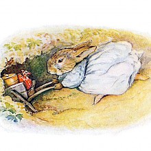 A female rabbit goes into a burrow pushing a wheelbarrow