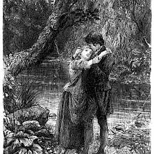 A young man and woman stand clasped in each other's arms on a river bank
