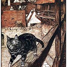 A cat strolls along the wooden railing of the outdoor walkway of a medieval-looking house