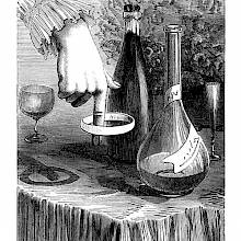 A woman's hand is seen with a napkin ring made to spin around the tip of the forefinger