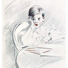 A boy sitting at a table has stopped drawing and leans on his elbow