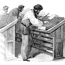 A compositor is leaning over the lower case with a composing stick in his left hand