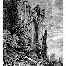 View of the façade of a somewhat run-down castle and an ascending side street
