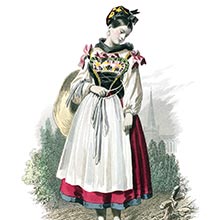 An Alsatian girl in traditional dress stands looking down at a cross on the side of the path
