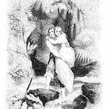 A young man carries a young woman in his arms to help her across a stream in the forest