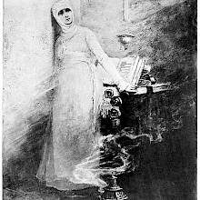 A nun stands in her cell as a beam of light comes in from the right and a smoking censer stands on the floor