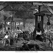 View of the forge at the Derosne & Cail Company showing workers heating and hammering metal parts