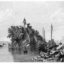 View of a rocky island on the Ganges, topped by a tower, with boats in the foreground