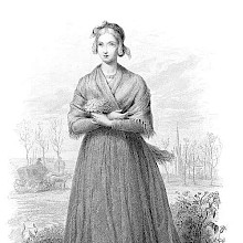 Full-length portrait of a young woman holding a small bunch of flowers