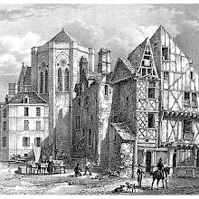 View of a square with a run-down timber-framed house,a church chevet, and a street merchant