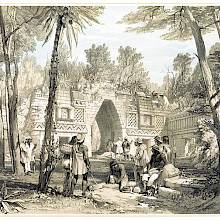 The remains of a Mayan building isolate a square from the forest spreading around