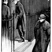 Two men stand on a doorstep at night, ready to go inside as a third one walks on past them