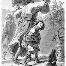 Gulliver stands on a street as a boy and his mother, carrying a tray on her head, pass him by