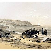 Haifa and the bay, with the skeleton of a boat in the foreground and Mt. Carmel in the background