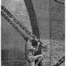 A man pulls himself up from the water using the chains of the ship