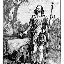 A man stands beside a table with a jug in one hand and a pole weapon in the other, looking defiant
