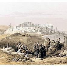 General view of Jaffa with the Mediterranean on the right and people resting in the foreground