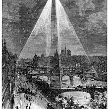 An aircraft flying in the Paris sky shines two beams of light on the Seine and the right bank