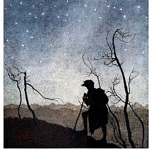 A man is silhouetted against the starry sky as he reaches the top of a hill