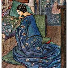 A woman is kneeling by the side of her bed, looking pensive