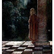 A young woman is seen from the back standing next to a tall column and staring out into the night