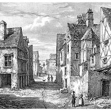 Cobbled street with half-timbered houses leading to Place des Arts, Angers, France