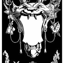 Ornament in the shape of a grotesque cat-like face with horns holding a cartouche