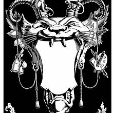 Ornament on a black background featuring a grotesque cat-like face with horns holding a cartouche