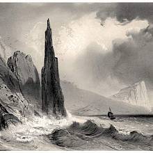 View of a rocky needle and cliff on the coast of Magerøya Island, near the village of Skarsvåg, Norway