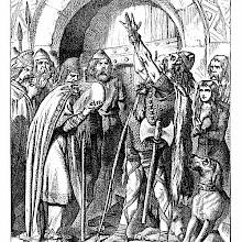 A Celtic warrior raises his arm to take an oath as an older man cries with his head in his hands