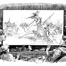 A group of people watches a screen showing a battle between people riding camels and horses