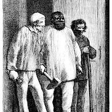 Three men wearing masks stand in front of a doorway in a threatening attitude