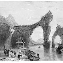 Limestone promontory forming an arch over the water, near Lake Taihu, China