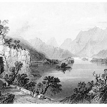View of the Upper Lake at Killarney, showing a road with a short tunnel cut through the rock