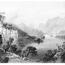 View of the Upper Lake at Killarney, showing a road with a short tunnel cut through the rock