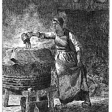 A woman doing the laundry pours the content of a pitcher into a large wooden bucket