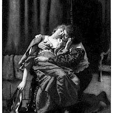 A man is kneeling next to a woman sitting on a chair and embraces her