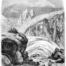 Alpine landscape with rocks, ice sheets, a jagged glacier, and spiky mountain peaks