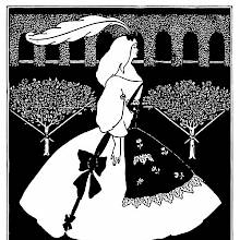 A woman in a white dress, with a feathered bow in her hair, is seen from the side standing in a park