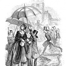 A couple walks in the rain and the man holds up an umbrella to protect his much taller wife