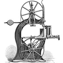 Side view of a band-resawing machine housed in a curved cast-iron frame with two large, multi-spoked wheels