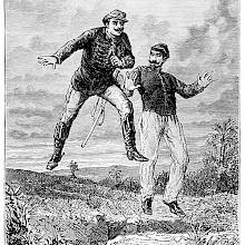 Two men are suspended in mid-air, one on his way up, the other on his way down