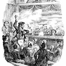 During a historical reconstruction of the Battle of the Nile, a man starts throwing fruit at the stage
