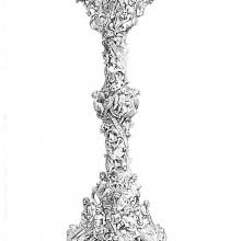 Gilt-brass candlestick with a decoration of human and animal figures