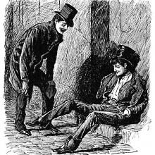 A drunk man is sitting on the pavement as his laughing friend leans toward him