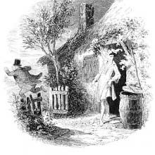 A man stands in a night shirt and cap in front of a cottage door